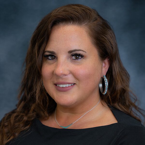 Smiling headshot photo of a woman named Mandy Danish.